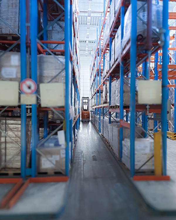 A narrow-aisle forklift picking orders at one of Memodo’s warehouses